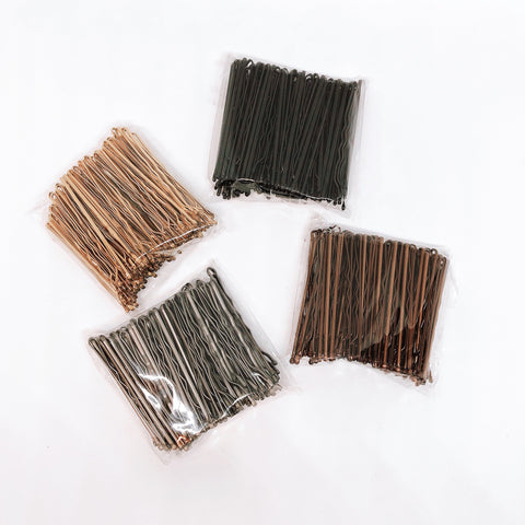 Bobby pins in several natural hair colors.